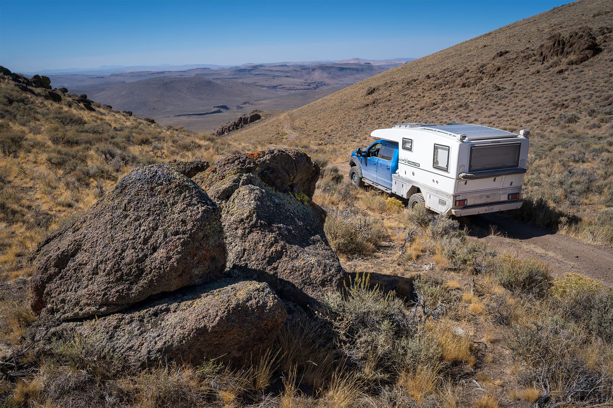 Hiker on mountain looking at view
