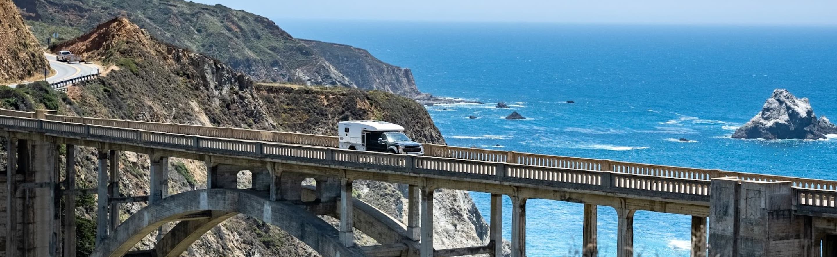 Truck driving across desert